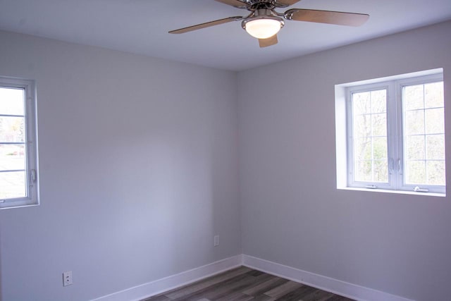 empty room featuring dark hardwood / wood-style floors and ceiling fan