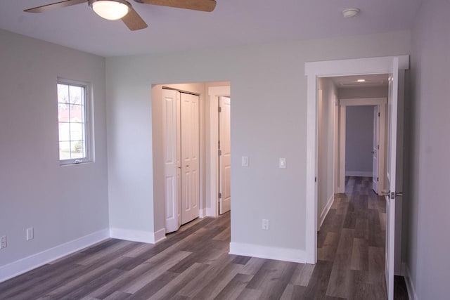 1642 Cottage Dr Unit 7-48, Lake Geneva, WI 53147 - empty room featuring a ceiling fan, baseboards, and dark wood finished floors