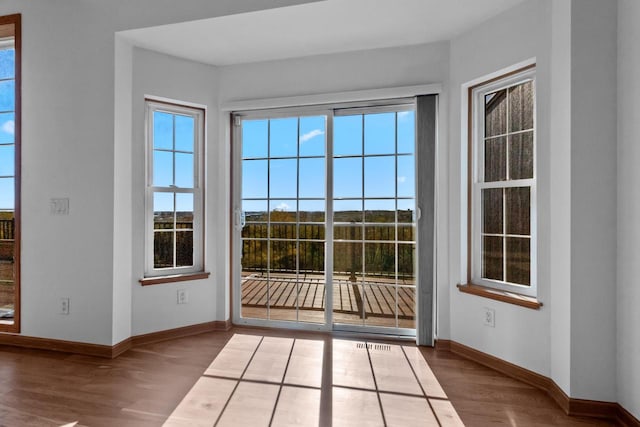 doorway to outside with hardwood / wood-style flooring