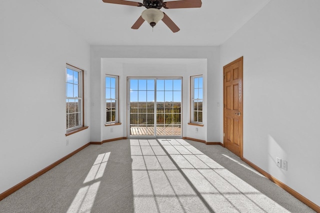 carpeted empty room with ceiling fan