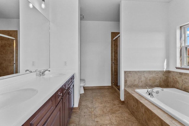 full bathroom with plus walk in shower, vanity, and toilet