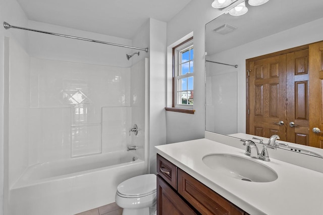 full bathroom with toilet, tile patterned flooring, vanity, and shower / bathtub combination