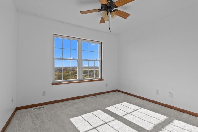 spare room with light carpet and ceiling fan