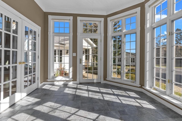 unfurnished sunroom featuring french doors