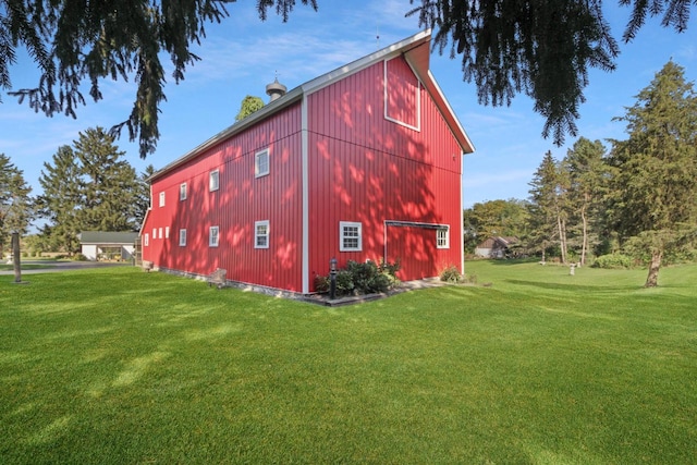 view of outdoor structure with a lawn