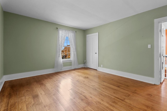 spare room featuring light hardwood / wood-style flooring