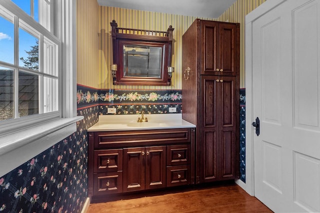 bathroom featuring vanity and hardwood / wood-style flooring