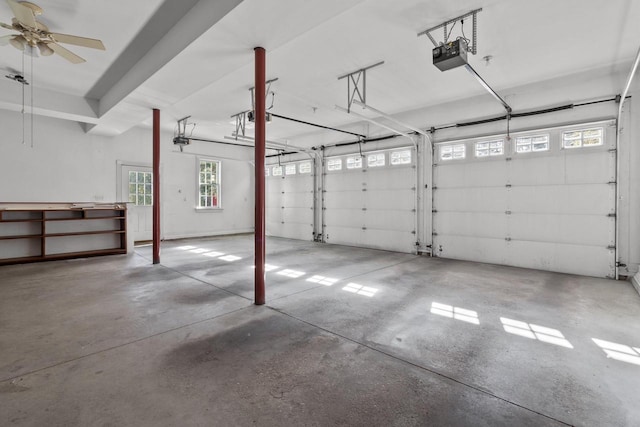 garage featuring a garage door opener and ceiling fan