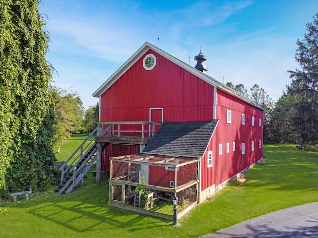 view of outbuilding with a yard