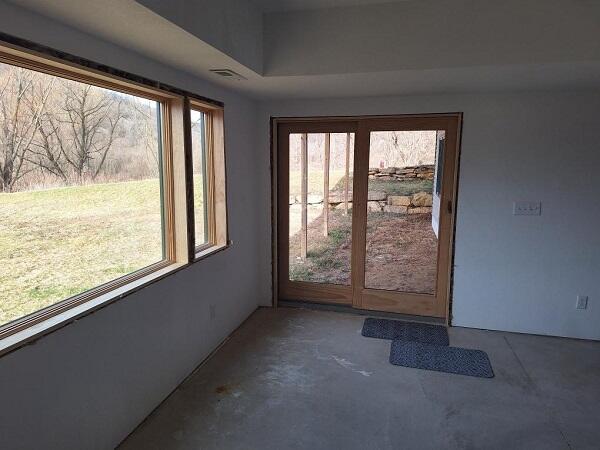 doorway to outside featuring concrete flooring