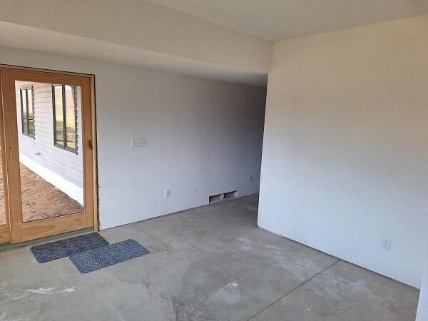 spare room with concrete flooring