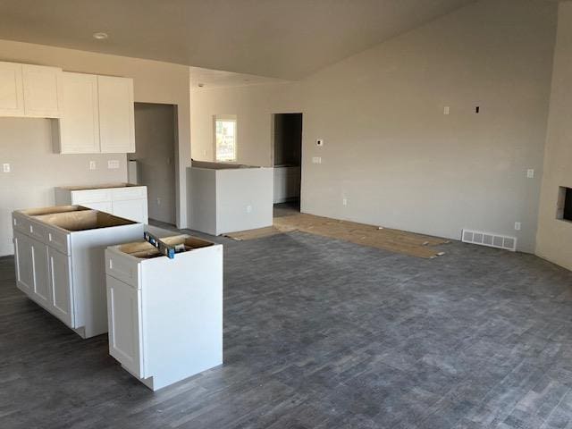 kitchen with white cabinetry and a center island