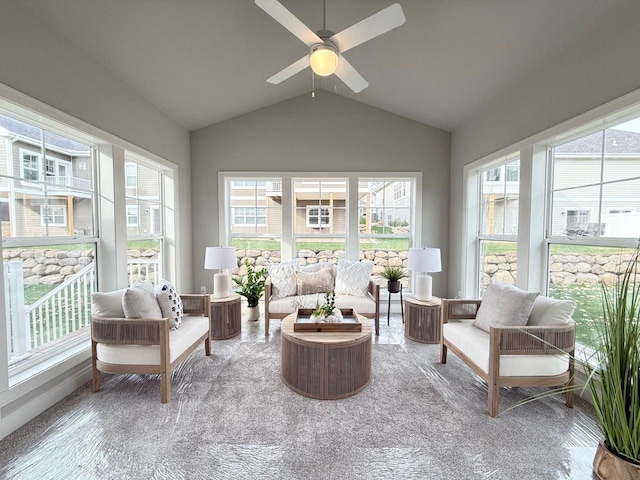 sunroom featuring ceiling fan and vaulted ceiling