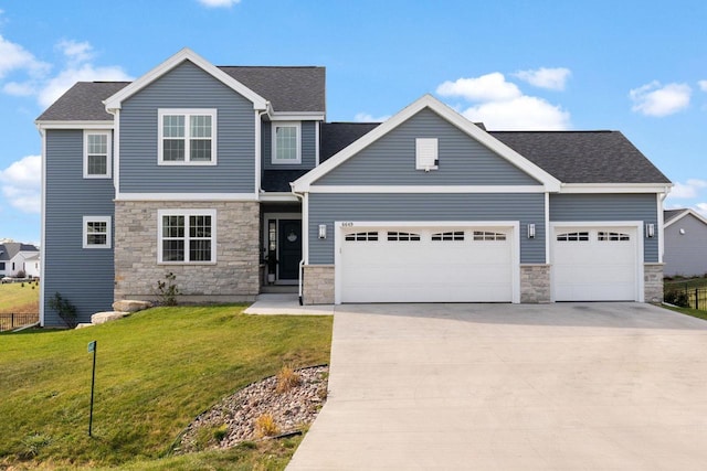 craftsman house with a garage and a front yard