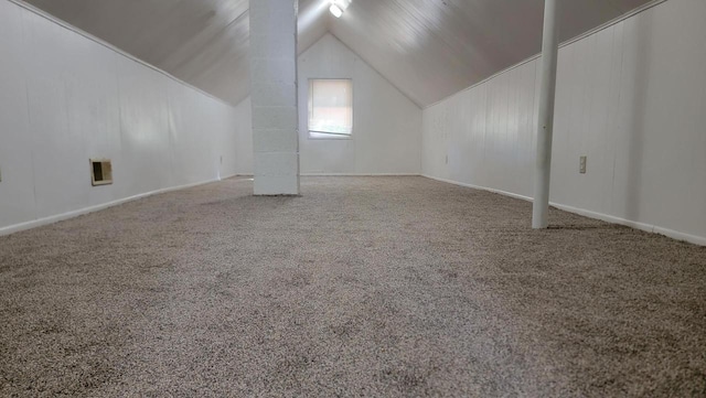 additional living space featuring lofted ceiling and carpet floors