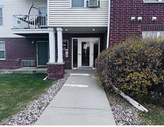 entrance to property with a balcony