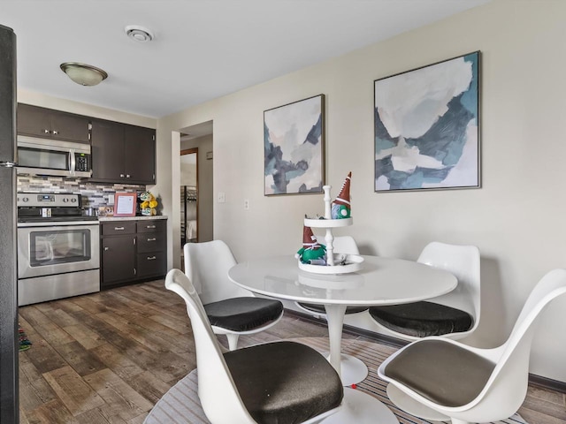 dining space featuring dark hardwood / wood-style floors