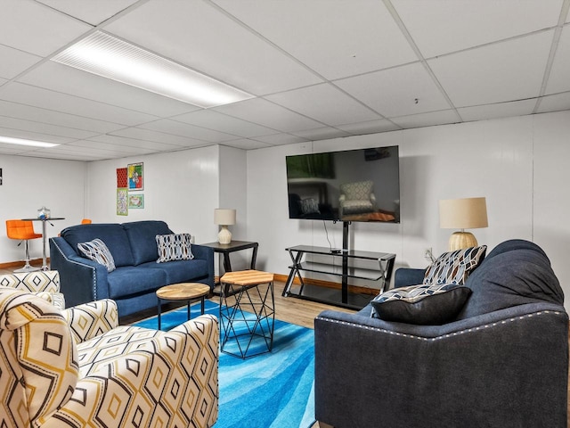 living room featuring a drop ceiling