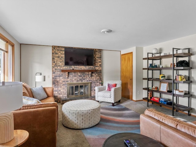 carpeted living room with a brick fireplace