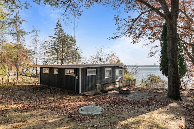 view of outbuilding with a water view