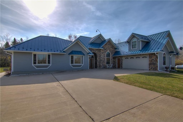 view of front facade featuring a front yard and a garage