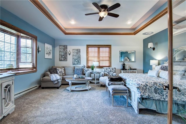 carpeted bedroom featuring crown molding, a baseboard radiator, a raised ceiling, and ceiling fan