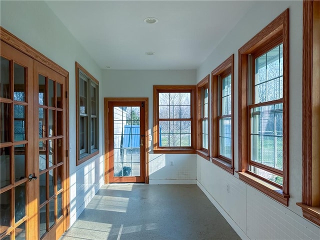 unfurnished sunroom with a wealth of natural light