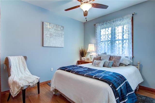 bedroom featuring wood-type flooring and ceiling fan