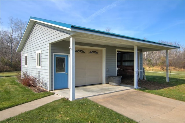 doorway to property featuring a lawn and a garage