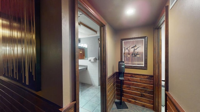 hallway featuring tile patterned flooring