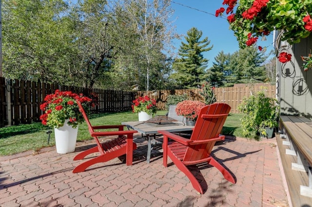 view of patio / terrace with a fire pit