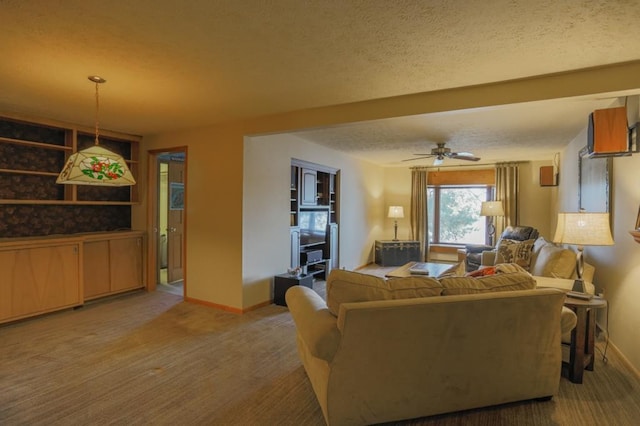 living room featuring a textured ceiling and ceiling fan