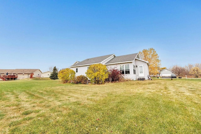 view of property exterior with a lawn