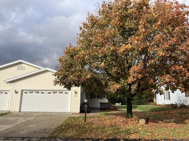 obstructed view of property with a garage