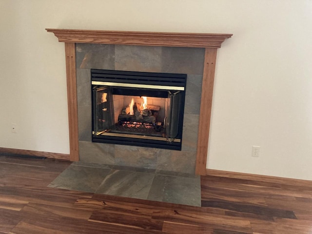 1524 Deer Brook Dr, Two Rivers, WI 54241 - detailed view of a fireplace, wood finished floors, and baseboards