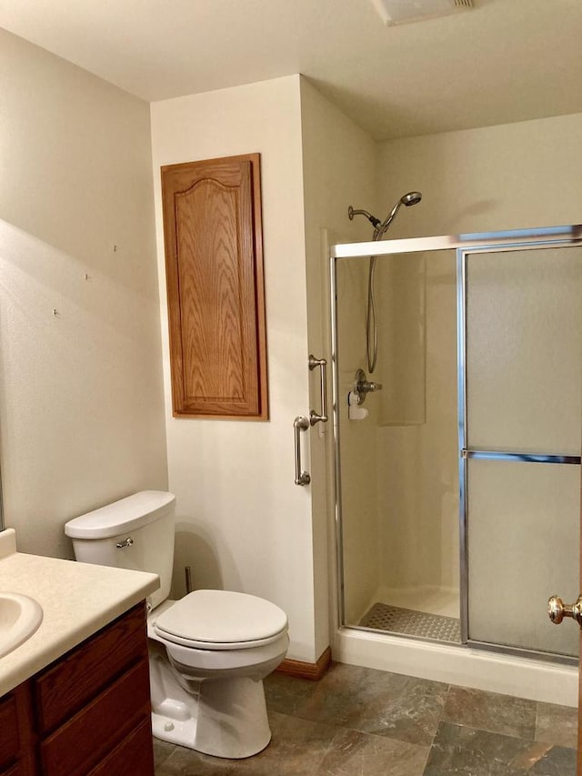 1524 Deer Brook Dr, Two Rivers, WI 54241 - full bathroom with a stall shower, toilet, vanity, and baseboards