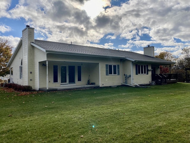 1524 Deer Brook Dr, Two Rivers, WI 54241 - back of property with a chimney and a yard