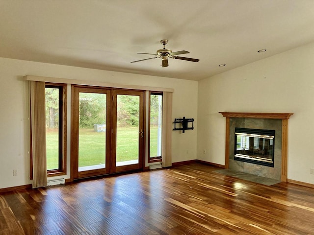 1524 Deer Brook Dr, Two Rivers, WI 54241 - unfurnished living room featuring wood finished floors, ceiling fan, baseboards, and recessed lighting