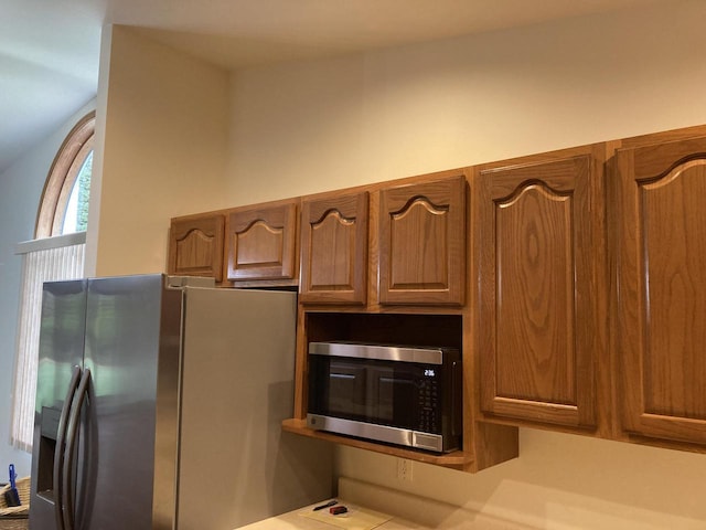 1524 Deer Brook Dr, Two Rivers, WI 54241 - kitchen featuring appliances with stainless steel finishes, brown cabinetry, and light countertops