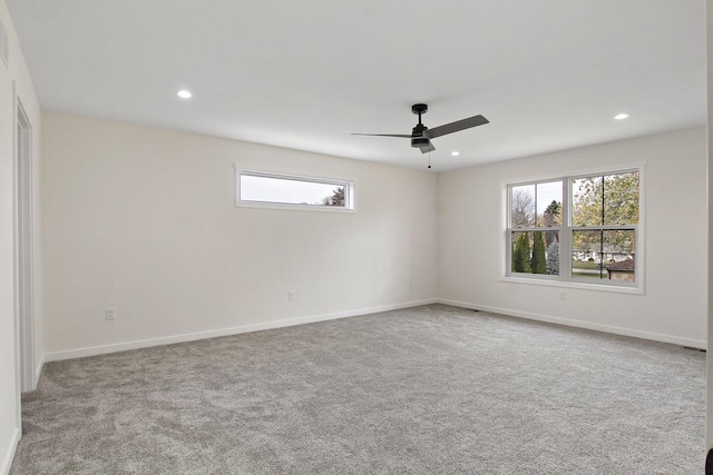 carpeted empty room featuring ceiling fan