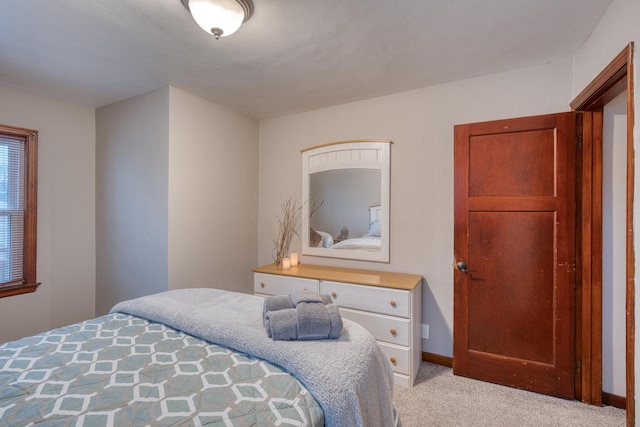 bedroom with light colored carpet