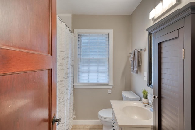 bathroom with vanity, toilet, a shower with curtain, and tile patterned floors