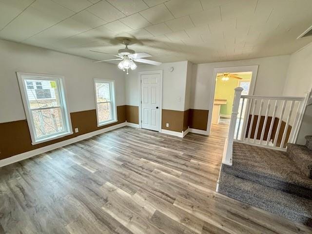 414 8th St, Baraboo, WI 53913 - interior space featuring ceiling fan, wainscoting, and wood finished floors