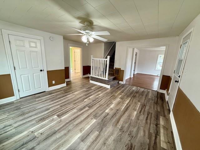 414 8th St, Baraboo, WI 53913 - interior space featuring stairs, ceiling fan, baseboards, and wood finished floors