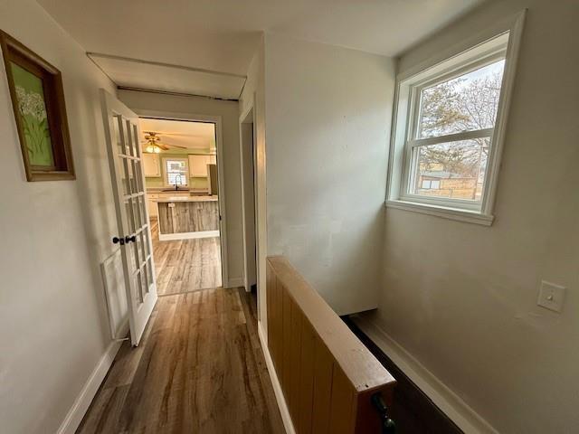 414 8th St, Baraboo, WI 53913 - hall with baseboards and wood finished floors