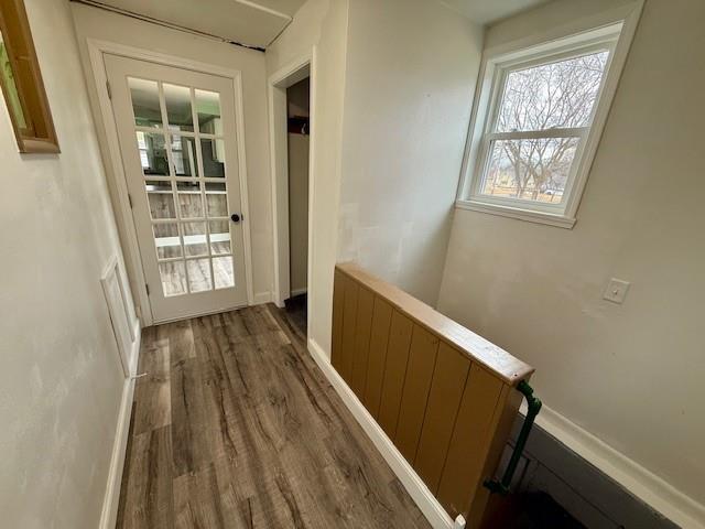 414 8th St, Baraboo, WI 53913 - corridor with baseboards and wood finished floors