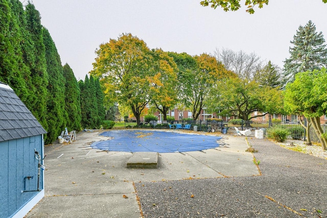 view of swimming pool featuring a patio area