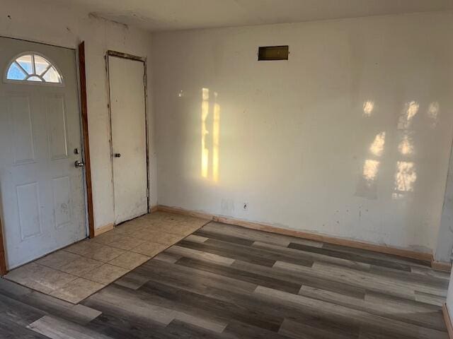 foyer with wood-type flooring