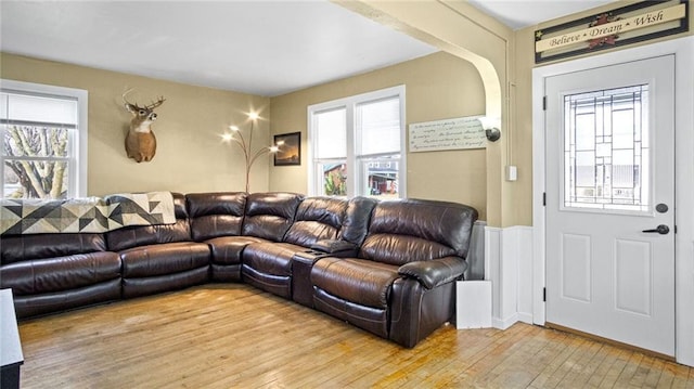 living room featuring plenty of natural light and light wood-type flooring