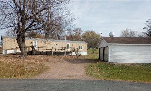 exterior space with an outdoor structure and a garage